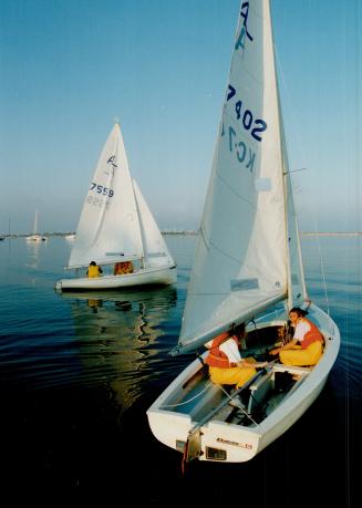 New members of Westwood Sailing Club learn the basics in Albacores: Left to right: Marg Vaillancourt and Leslie McShane get set to sail, Jane Drury sets out on her maiden voyage