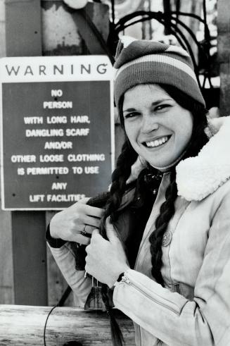 Carol MacDonald tucks her dark braids inside her ski jacket before she heads for ski lift at Medonte Mountain Ski Area, near Craighurst. Dangling scar(...)