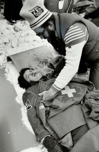 Winter victim: Bill Currier applies first aid to Sue Valentine, simulating a skier who has just suffered a bad accident during the recent Canadian Ski Patrol Competition at Kawartha Peaks in Bethany