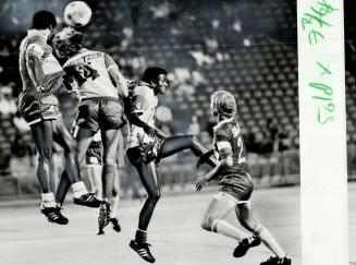 New ballet: Tony Whelan (left) of Chiefs and Gordon Sweetzer and Julius Sono of Blizzard stage their own little ballet as they go for ball during NASL game last night at Exhibition Stadium