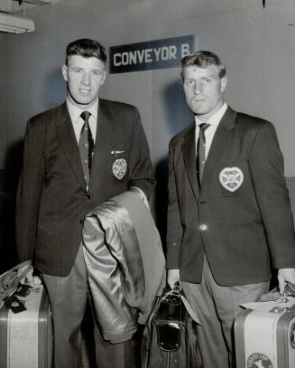 Captain Jimmy Milne (left), Andy Bowman, Heart of Midlothian Soccer Club Arrives in Town
