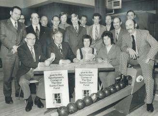 President Lou Detsky got staff together at All Canada Bowling headquartes to count up $6,226