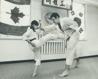 Lina Cheung, 13, is an advanced student of TaeKwon Do