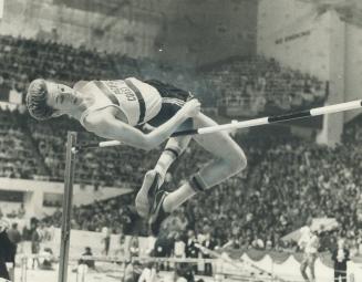 Dwight Stone of pacific Coast Club clears the bar at 7 feet, 3 1/2 inches to win the high jump at last night's Star-Maple Leaf indoor games. Five comp(...)