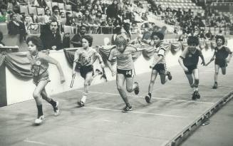 Exchange of batons is crucial moment in the 4x1 relay for teams of 12-year-old separate school runners