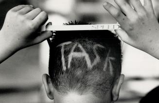 Boy's barbar not up to TASC. Darcy O'Connor, 9, wanted the initials TASC inlaid into his hair to adverise his Toronto Aquanauts Swim Club affiliation.(...)