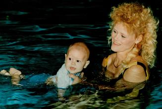 Private lifeguard. Theresa Clement and son Jordan, 5 months, are participating in an Infant Stimulation program at the Birchmount Pool. The program, r(...)