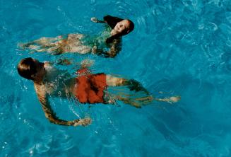 Catch a wave: Left, Terry Haroy, of Richmond Hill, and Jody Glanzer, of Thornhill, cool off at Sunnyside Gus Ryder Pool
