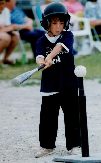 League of her own: Erika Ann Burgoyne, 5, of Brampton steps up to bat in Brampton Girls' Softball Association T-ball action