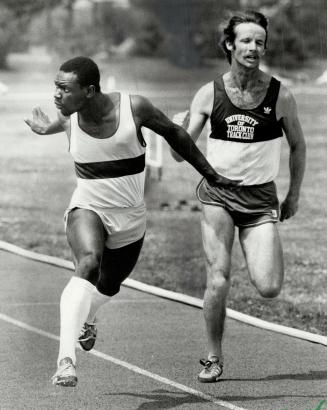 Last gasp: Tim Breadner, left, of Mississauga Track Club, makes final lunge at the wire to beat Edmond Shirley of Scarborough Optimists in 100-metres race at Trackfest '81 yesterday