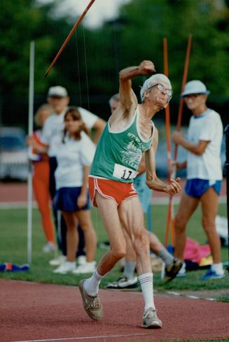 On the left, 70-year-old Canadian javelin thrower Ian Hume unleashes a mighty toss in yesterday's action in the masters track and field meet at York U(...)