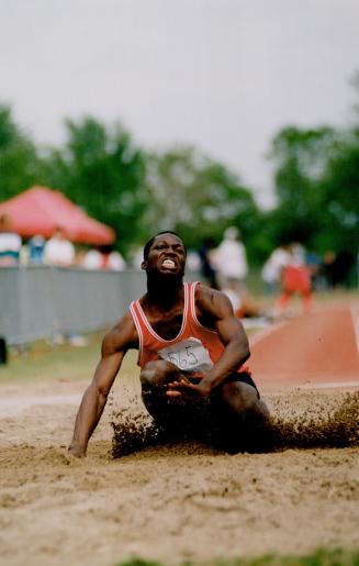 It's the pits: Emery's Herman McKenzie gave it that old high school try but came up short in the senior boys' long jump yesterday at York University