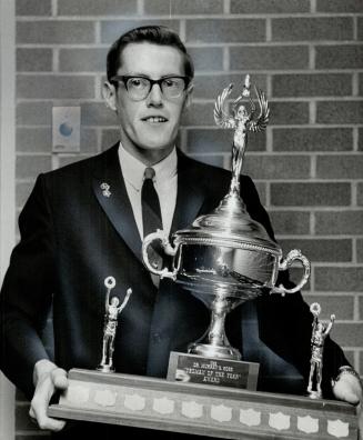 David Smith, national cross country champion runner, with Yoeman of Year award he received last night at York University's first athletic awards banquet