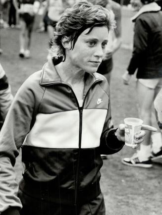 Home and dry: Nurse Jennifer White of Oregon, who won the women's marathon by finishing 58the overall, had a short drink following her victory and htne it was off to her hotel for a quick shower