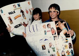 Craig Rosenblatt, above left, and Perry Argiropoulos, both 12, brought along home-made posters to cheer on their favorite wrestler, Hulk Hogan, as did(...)