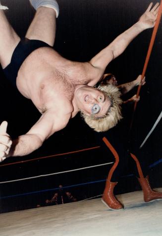 Airborne Adonis. Somehow - believe it or not - Adrian Adonis survived this high-flying flip from George (The Animal) Steele, rear, and won himself a m(...)