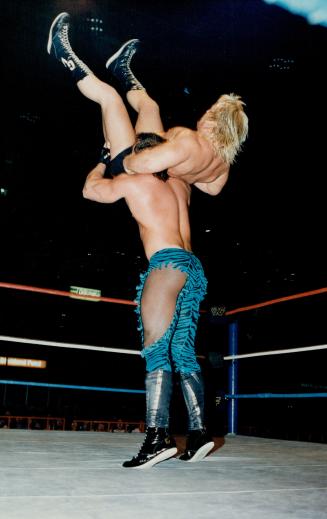 Blond bomber Greg (The Hammer) Valentine has his paws full with Brutus (The Barber) Beefcade
