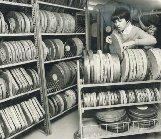 Audio-visual co-ordinator Laura Murray looks over the Metro Library's huge selection of films