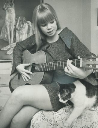Marg Unrah, 23, sings one of her own copositions, She's making a name for herself with her music and her art