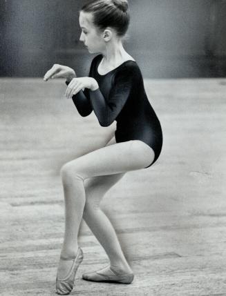 Deeply engrossed in her role, Annette rehearses for the scene where she tiptoes into the world of sugar plum fairies and toy soldiers