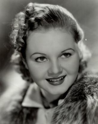 June Storey of Toronto . . . one of the most promising of younger film actresses . . . made her film debut in the same picture as Nelson Eddy