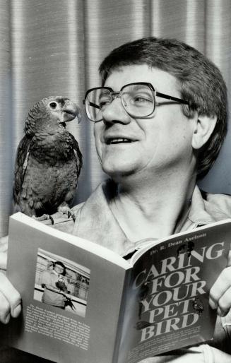 It's for the birds: Veterinarian Dean Axelson and Lolli, a green-cheeked Amazon parrot, review new book