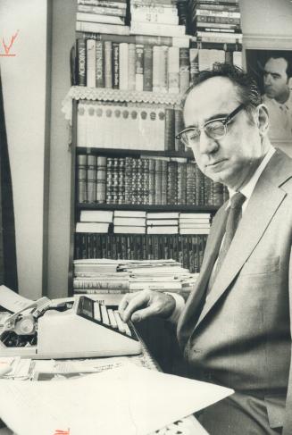 Louis Kenderessy at typewriter
