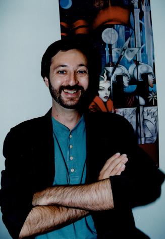 Fantasy world: Guy Gavriel Kay stands in front of the poster for his latest novel; Tigana.