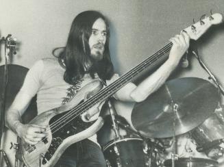 Bass guitarist Doug Thompson and colleagues in Supertramp rock band