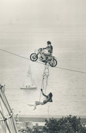 Riding High: Daredevil Hans Winn is towing his partner Karl Winn above Ontario Place, while the sailboat below moves in a more conventional manner