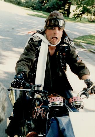 High on a 'hawg' of a bike: Bob Bobcat Goldthwaite plays gangleader Zed in Police Academy 3, now filming on the lakeshore