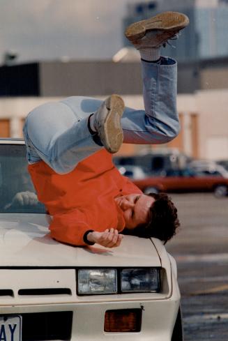 New breed of stuntman, Stuntman Ken Quinn, of Mississauga, gets 'hit' by a car in the parking lot at Square One shopping centre in Mississauga