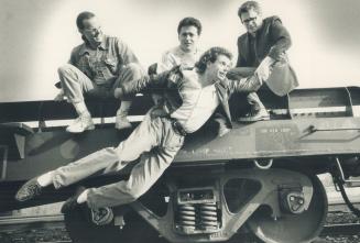 Fred's Bicycle Repair Shop: Peter Ivaskin gets a lift from (from left) Owen Demers, Doug Morency and Peter Iwaskiw