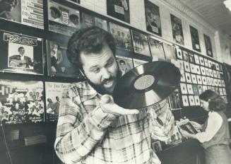 Disc dealer Don Keele gets ready for Sunday's flea market (see Great Events) of old records and related collectibles