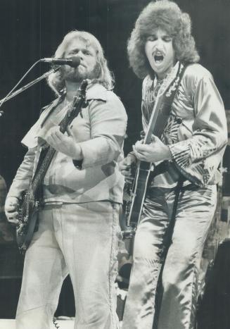 Fred Turner and Blair Thornton gave 23,000 cherring fans what they came to hear at the Bachman-Turner Overdrive concert at the CNE Grandstand last nig(...)