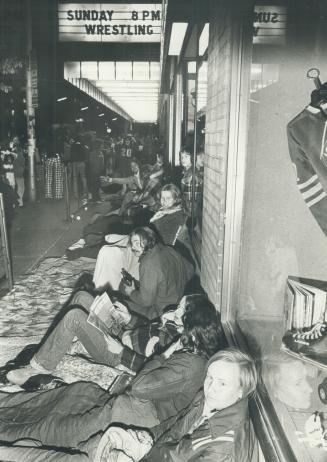 Kids waiting in line at Maple Leaf Gardens for tickets to George Harrison Concert