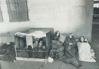 Waiting for the box office to open Friday morning, four residents of Mimico camp outside Maple Leaf Gardens to buy tickets for a concert Dec. 6 by for(...)