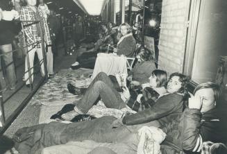 Kids waiting in line at Maple Leaf Gardens for tickets to George Harrison Concert