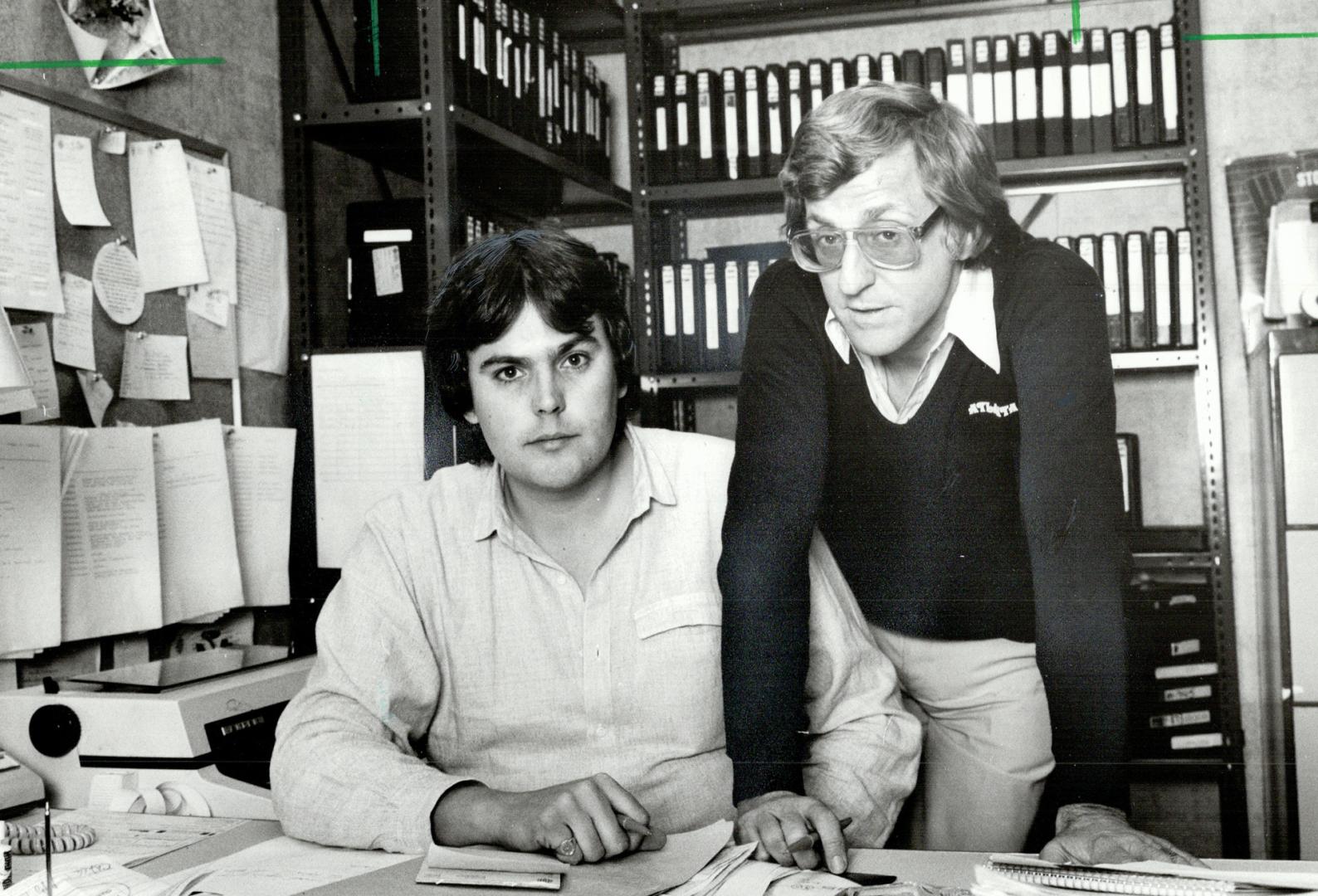 Back home safely: David Studer (left), a CBC reporter, and John Scully, a producer, are back in the safety of the CBC Newmagazine studios after facing soldiers's guns on assignment in EI Salvador