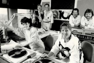 Bob Mackowycz founder of Q107 and Gary Slaight standing