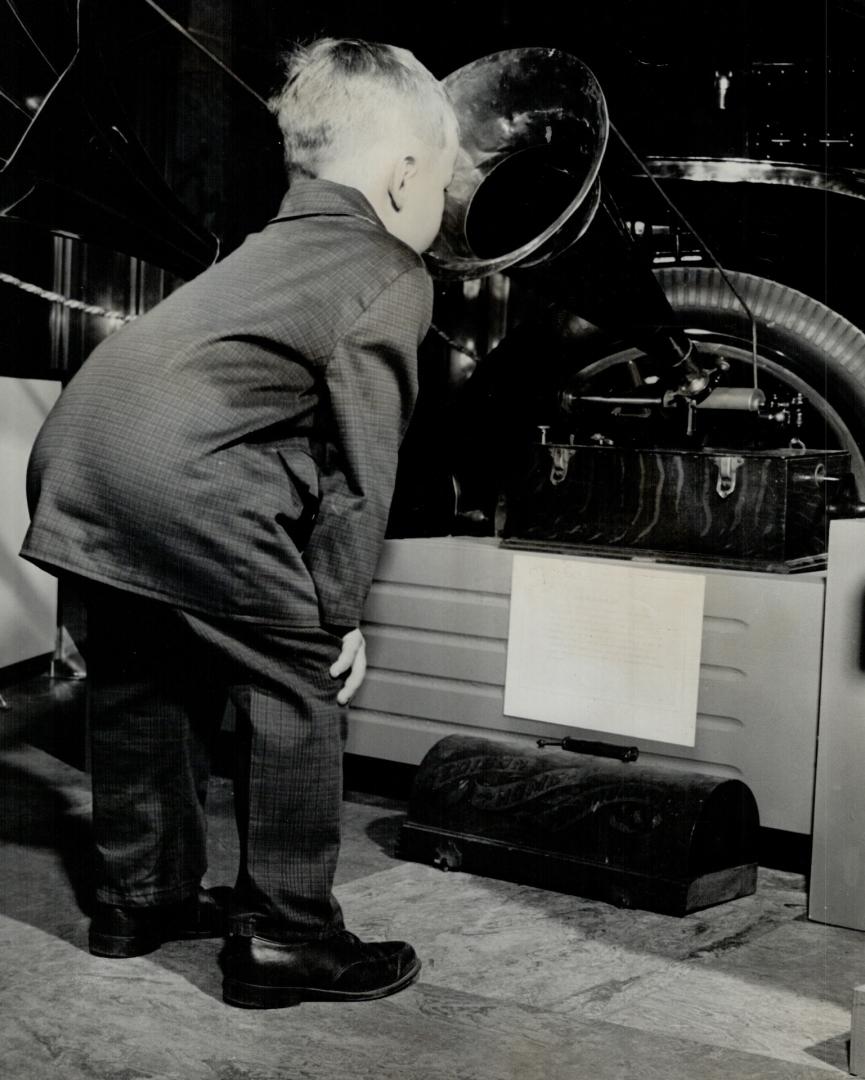 Darryl Thorogood, 4, examines 1898 Edison Phonograph