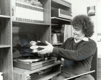 Student Rick Kahn relaxes with his stereo when not working at selling stereos