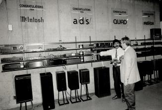Big choice: Bay-Bloor Radio salesman Fernando Pascoa shows a customer the variety
