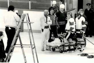 St. Michael's Arena, hockey playersare working in a commercial designed to show the dangers of violence in hockey