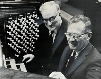 Two famous organists, Dr. John Dykes Bower (left), of St. Paul's Cathedral in London, and Dr. Charles Peaker of St. Paul's Anglican Church in Toronto,(...)