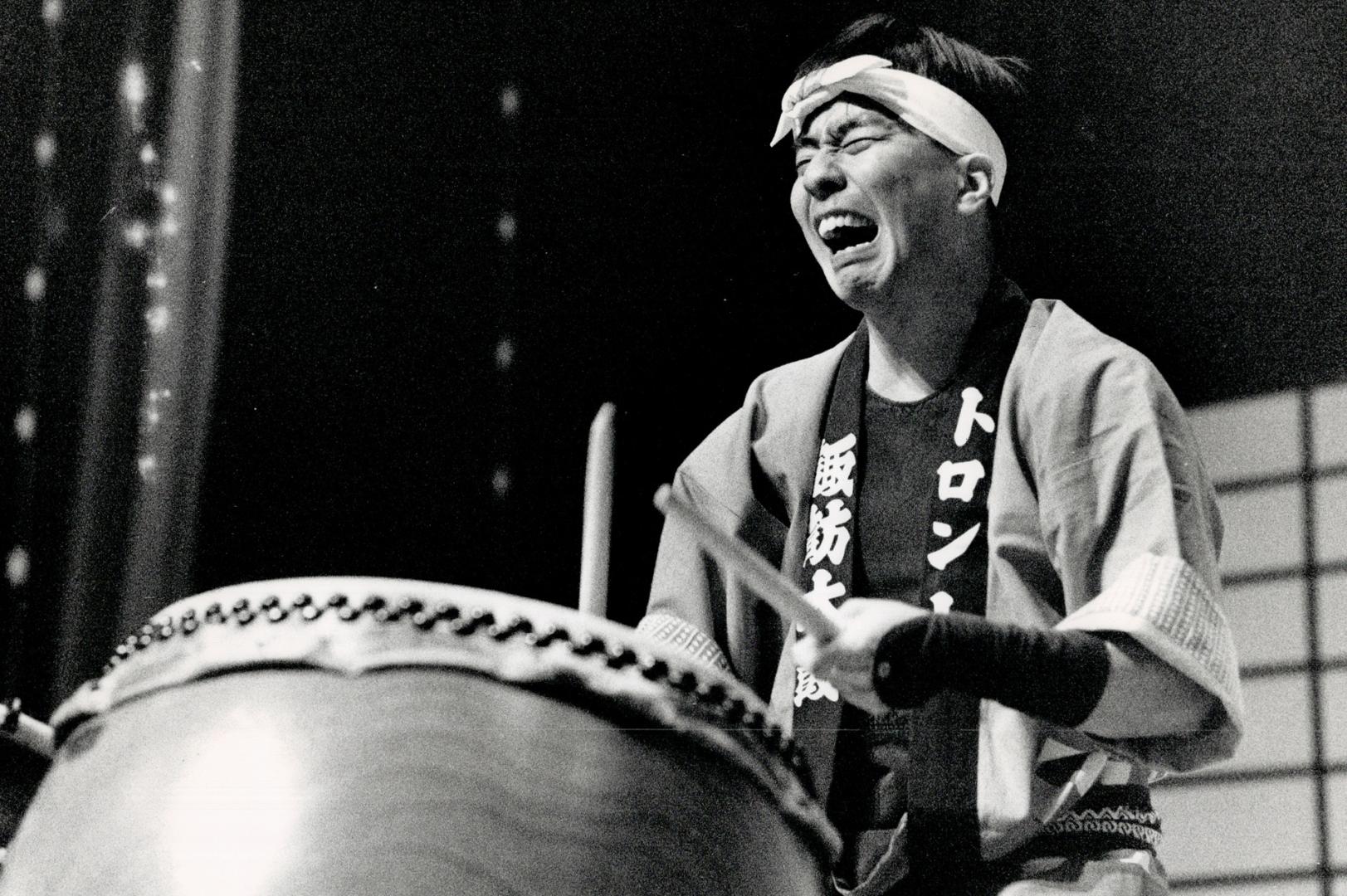 Drum beat: A drummer with the Toronto Suwa Daiko troupe sends up a tempest of sound to add to all the other sense-awakening features of the festival