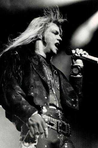 A Bellicose Dandy: . . . with limited vocal power is how critic Craig MacInnis describes Bret Michaels of rock band Poison. Is there another singer as boldly narcissistc . . ?