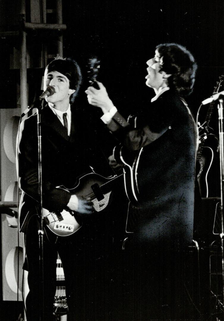 Joey Curatolo is Paul McCartney (left), Robert Williford is John Lennon