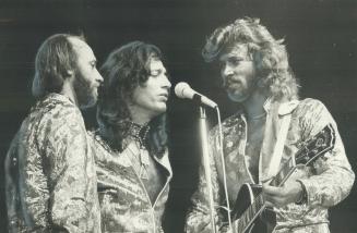 Friday night fever: The Bee Gees, from left, Maurice, Robin and Barry Gibb, started with a happy boom and gave a capacity crowd of 18,500 at the Gardens a sensual show