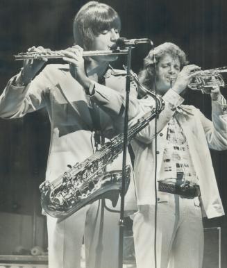Chicago at the grandstand. The rock band Chicago last night gave the second of its concerts at the CNE Grandstand this year. Star critic Peter Goddard(...)